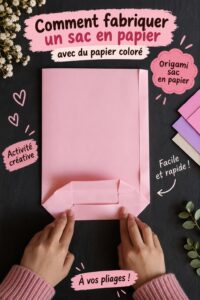Sac en papier coloré sur une table de travail avec des fournitures de bricolage